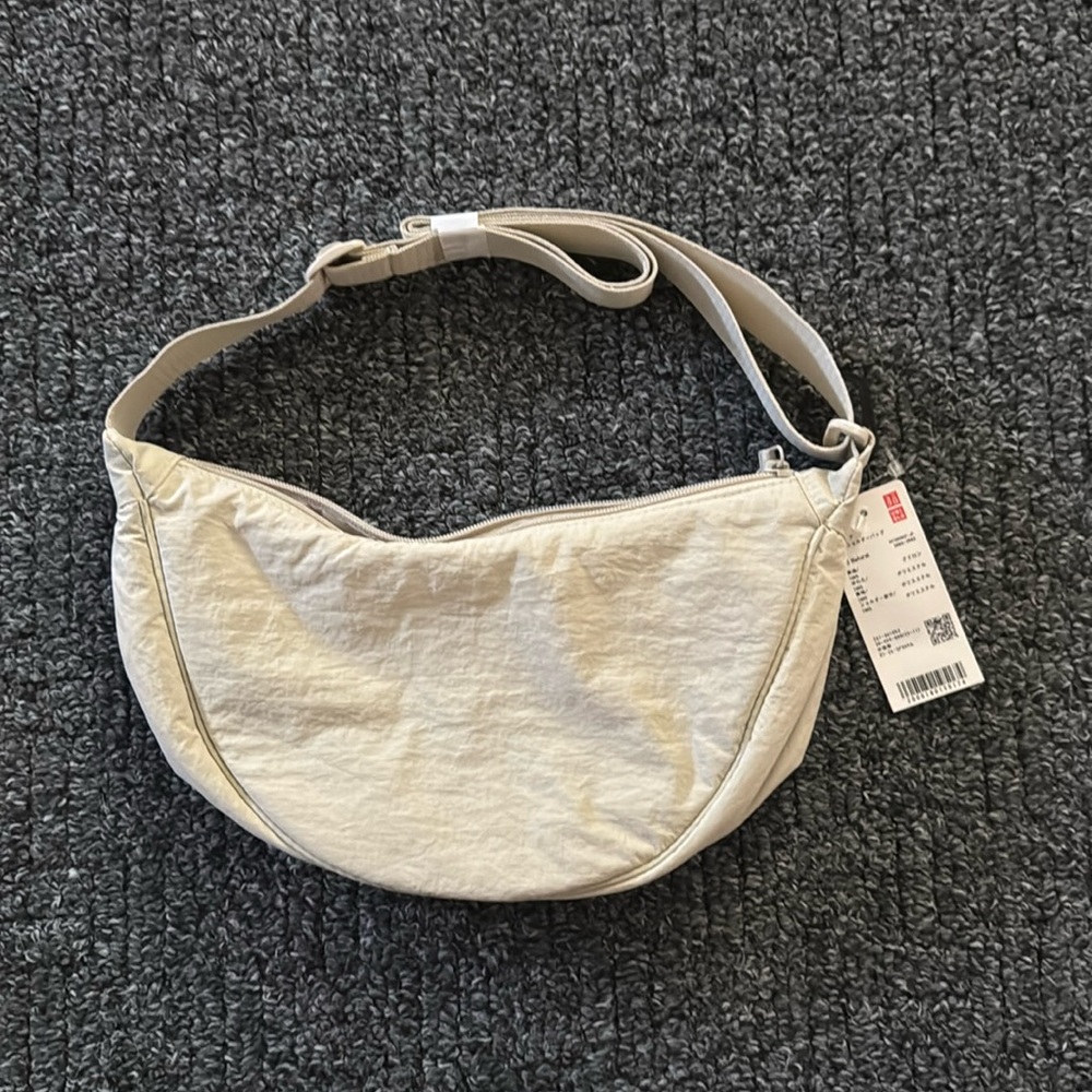 Uniqlo cream round mini shoulder bag bought in Japan NWT.